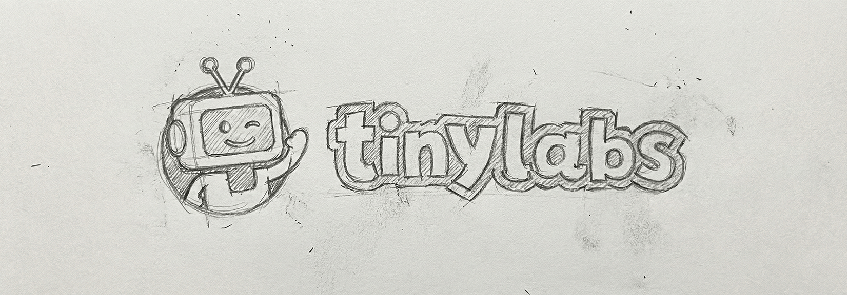 Pencil sketch of the Tinylabs mascot on ruled notebook paper, marked with a 90 by 90 construction grid and unit measurements